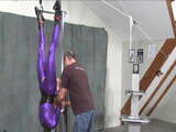 Suspended in a purple suit